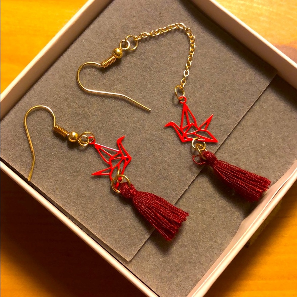 Asymmetric dove earrings